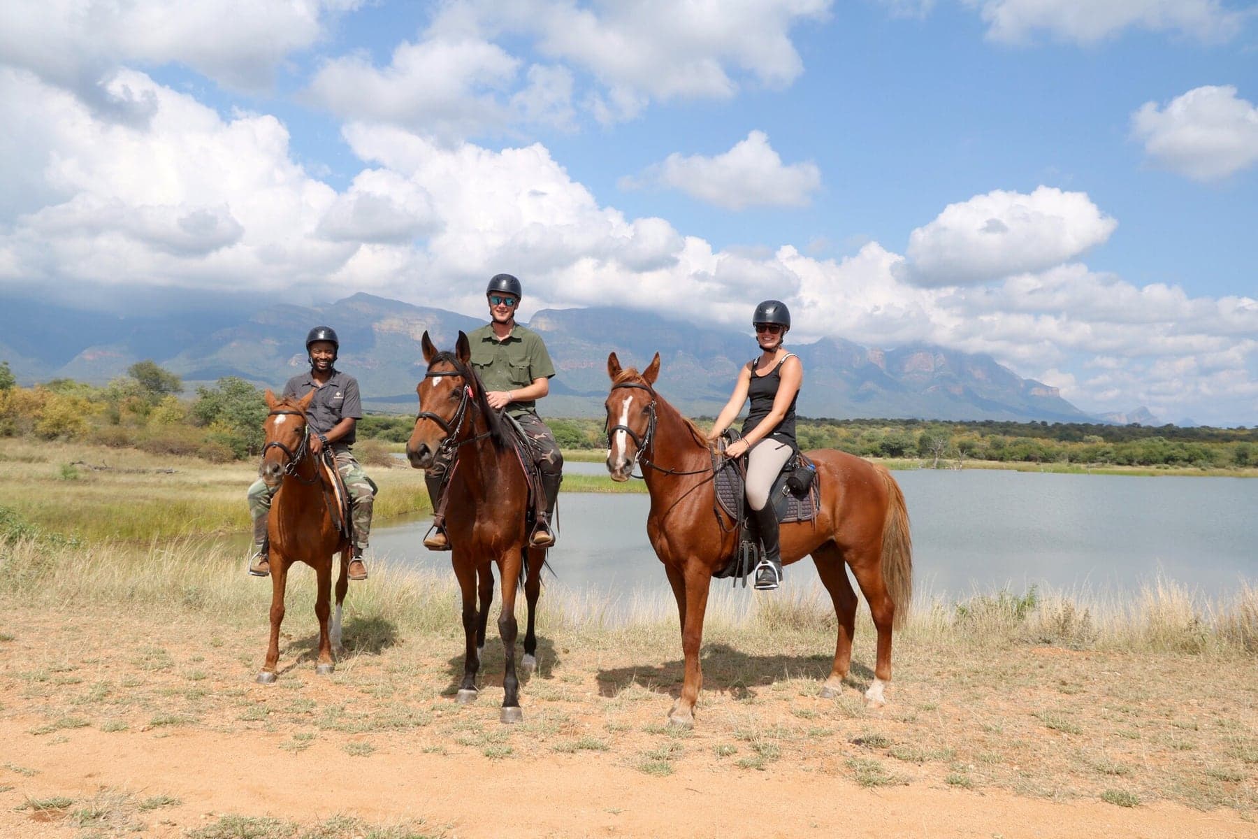 Riders beside the dam during a trail ride